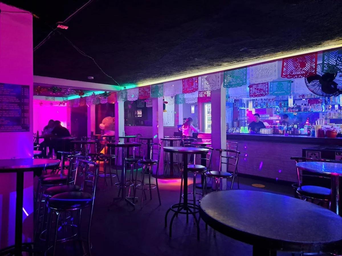 Upscale interior of La Chuparosa in Waukegan showcasing modern Mexican fusion dining atmosphere with warm lighting and stylish seating